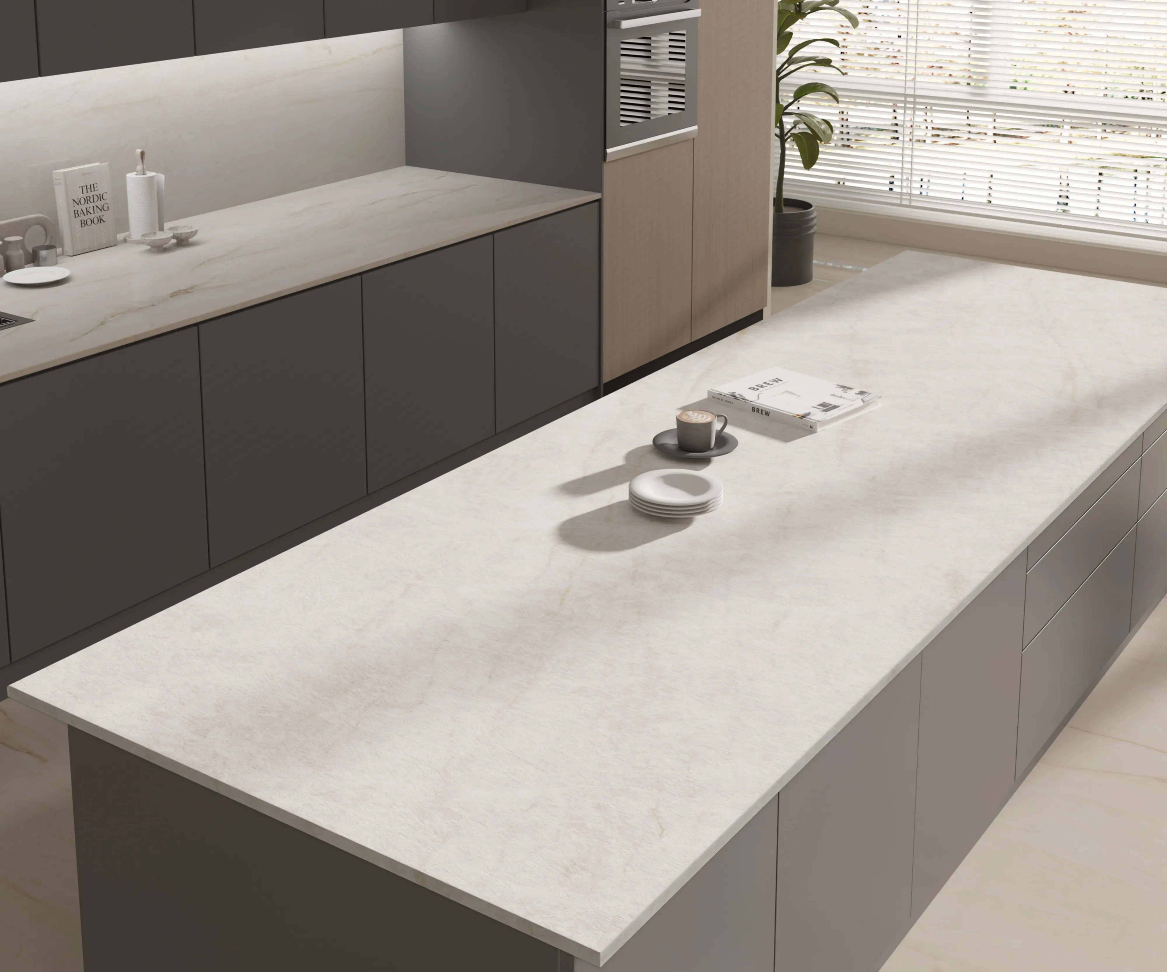 Taj Mahal Pearl porcelain island in a dark kitchen
